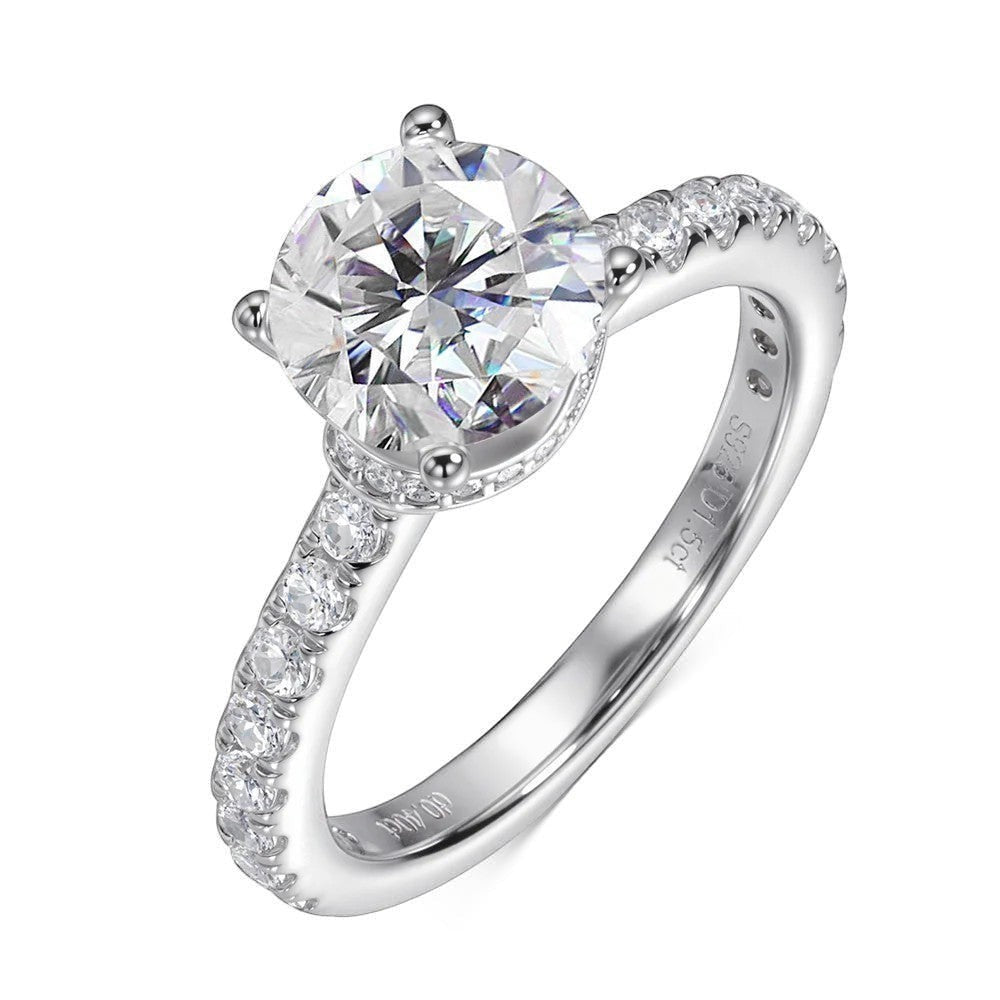 Bee-Bees 1.5ct round brilliant moissanite engagement ring in sterling silver with pavé band.