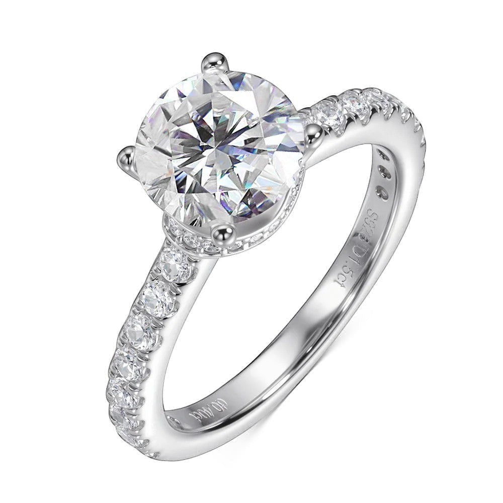 Bee-Bees 1.5ct round brilliant moissanite engagement ring in sterling silver with pavé band.
