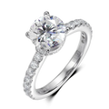 Bee-Bees 1.5ct round brilliant Moissanite engagement ring in sterling silver with 18k gold plating and pav
uevo band.