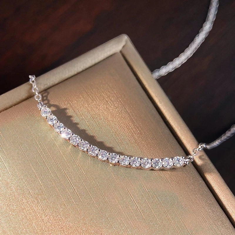 Bee-Bees 18k gold plated s925 sterling silver necklace with D VVS1 Moissanite stones in a curved smile design.