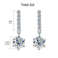 Bee-Bees 18k white gold plated sterling silver drop earrings with 1ct D color VVS1 moissanite and zircon accents.