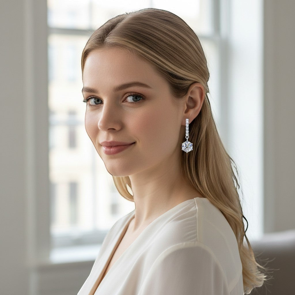 Bee-Bees 18k white gold plated sterling silver drop earrings with 1ct D color moissanite and zircon accents.