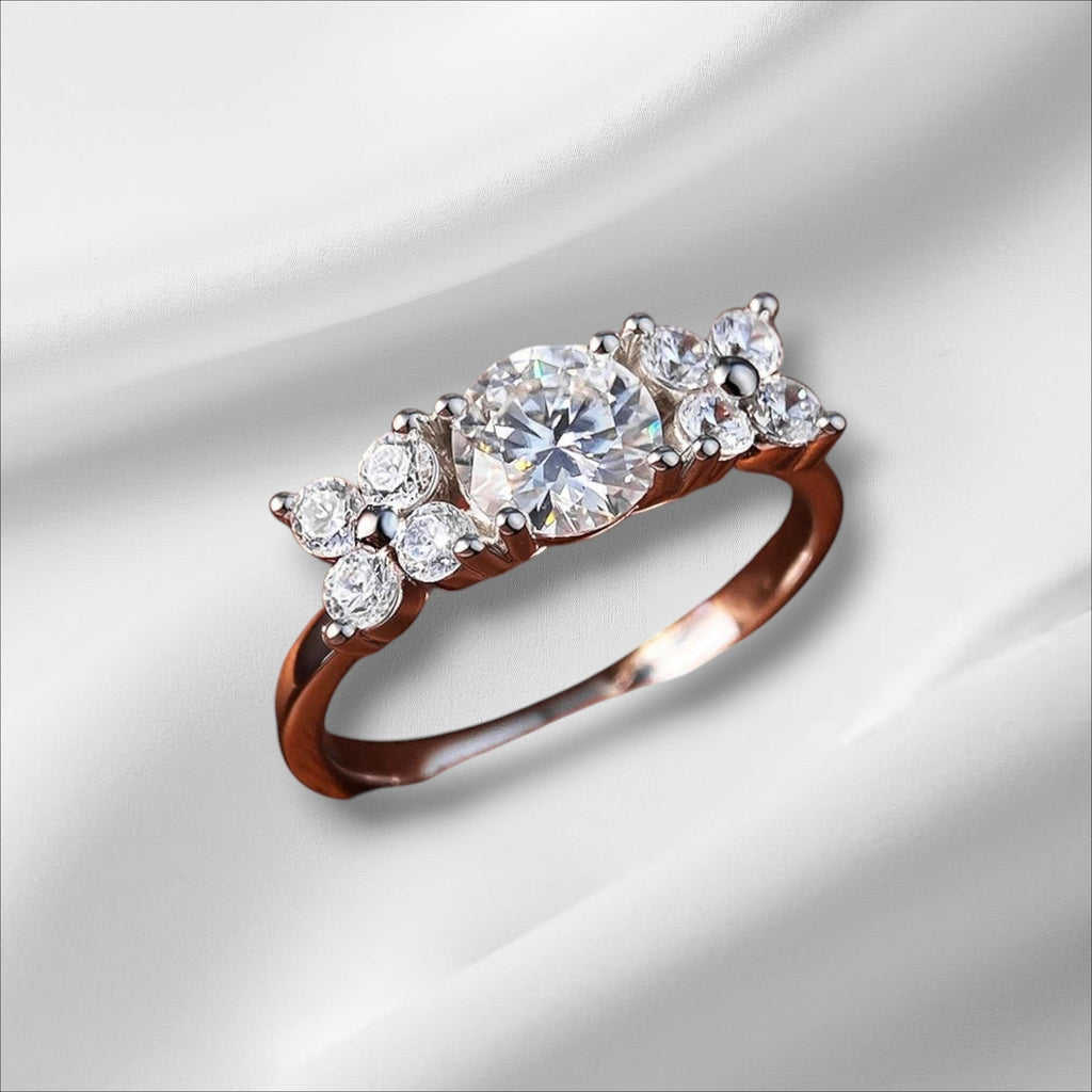 Bee-Bees 1ct D VVS1 round brilliant moissanite engagement ring with 18k white gold plating on sterling silver.