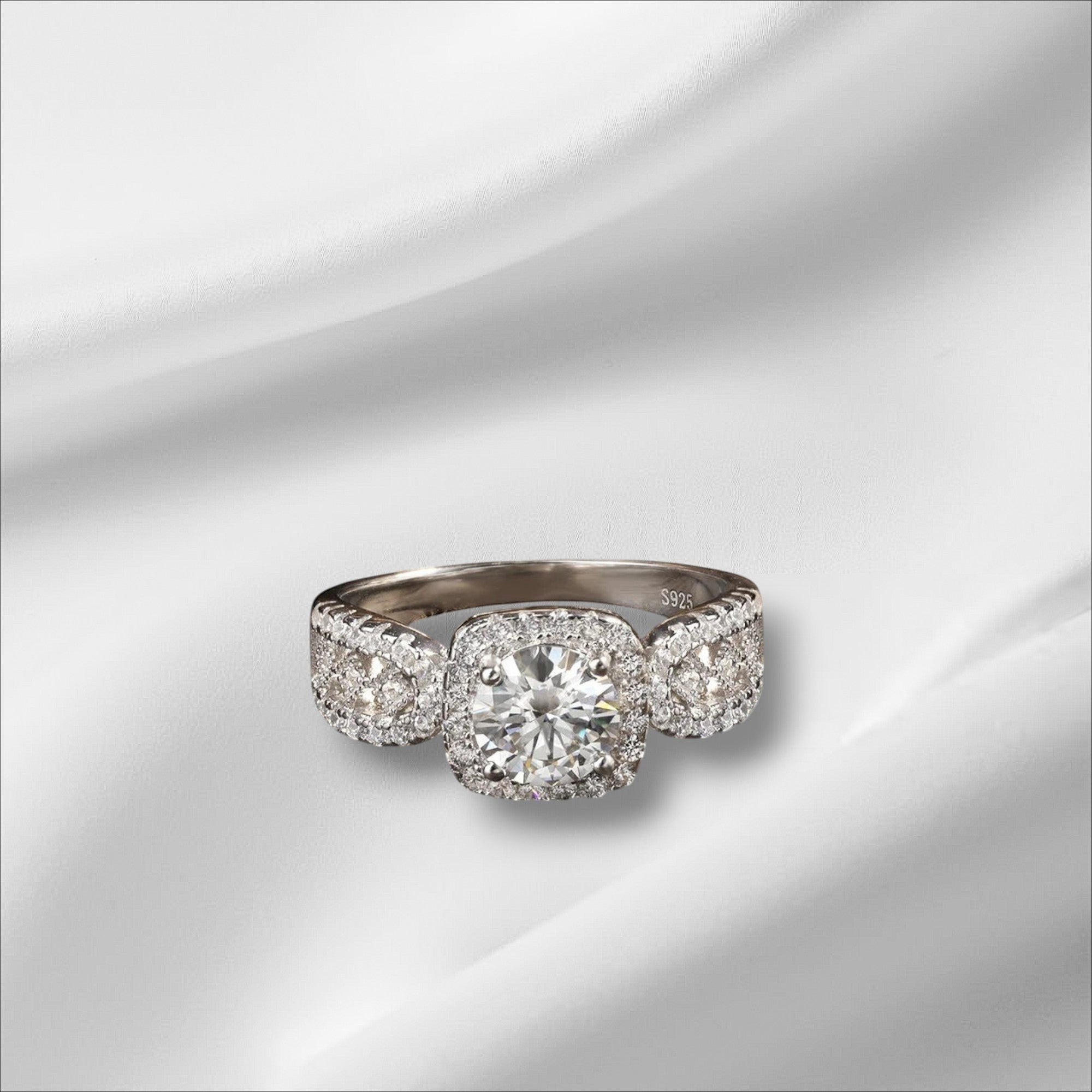 Bee-Bees 1ct D VVS1 Moissanite engagement ring in 18k white gold plated 925 silver with halo setting.