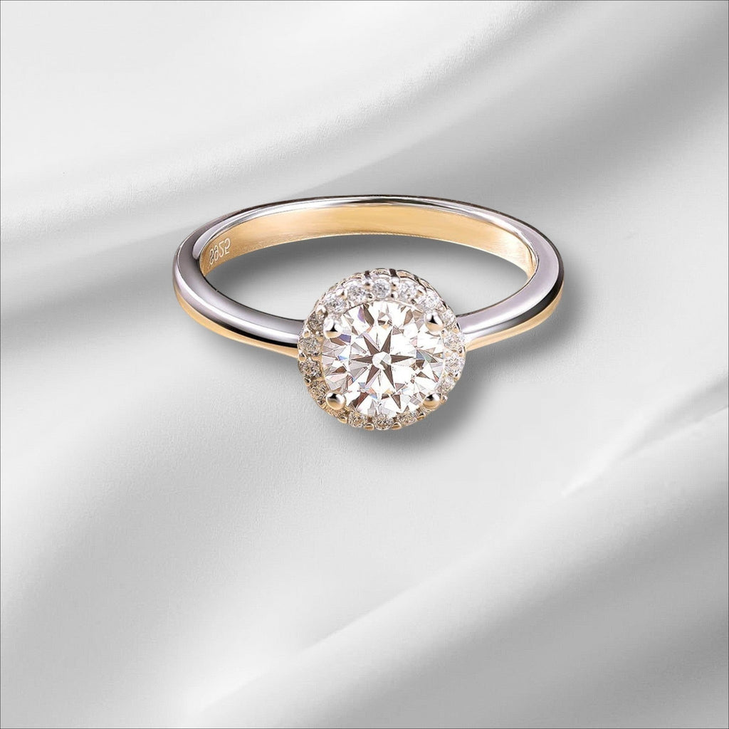 Bee-Bees 1ct round brilliant cut moissanite engagement ring in 925 sterling silver with 18k white gold plating.