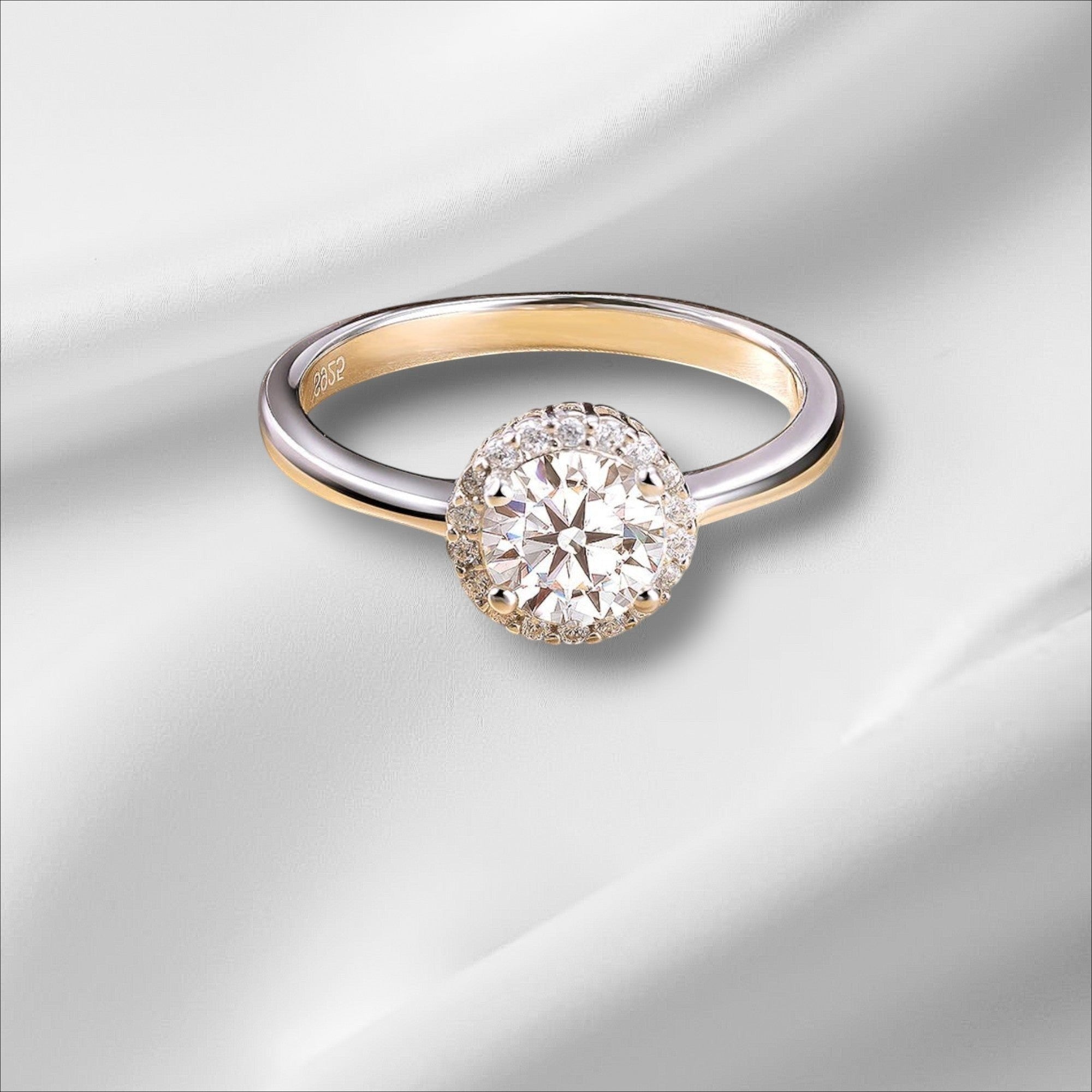 Bee-Bees 1ct round brilliant cut moissanite engagement ring in 925 sterling silver with 18k white gold plating.