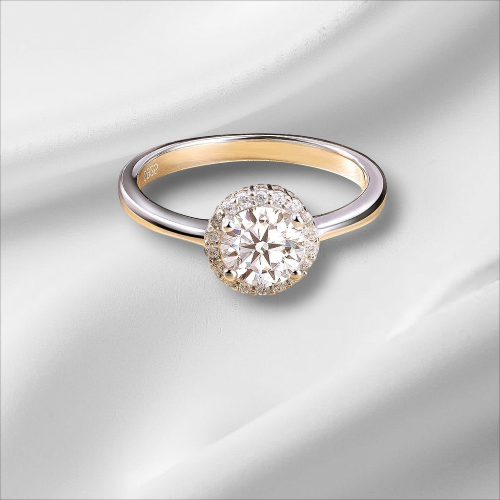 Bee-Bees 1ct round brilliant cut moissanite engagement ring in 925 sterling silver with 18k white gold plating.