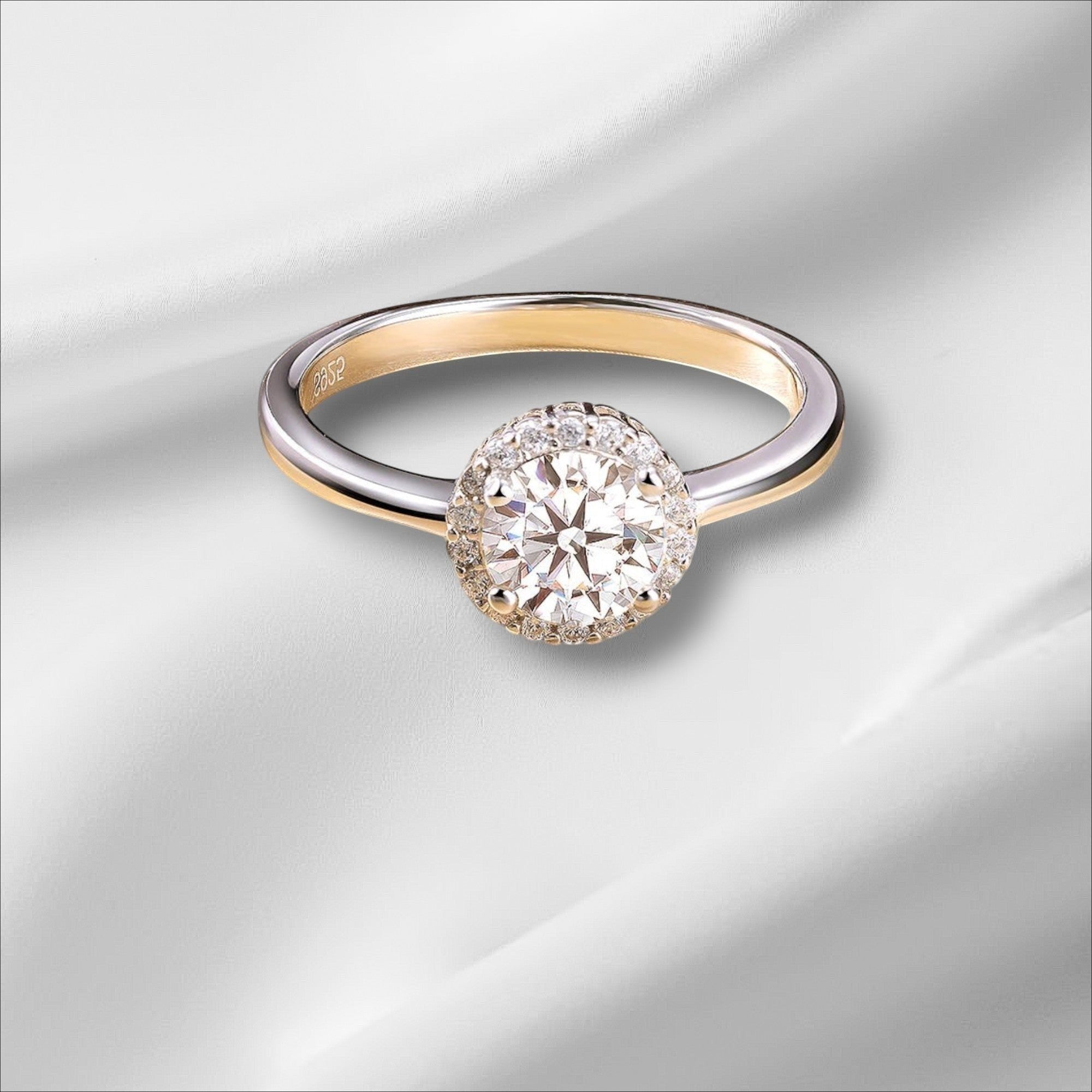 Bee-Bees 1ct round brilliant cut moissanite engagement ring in 925 sterling silver with 18k white gold plating.