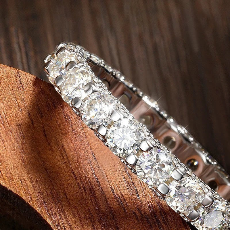 Bee-Bees 2.5ctw round D-color VVS1 moissanite full eternity band in 18k white gold plated S925 sterling silver.