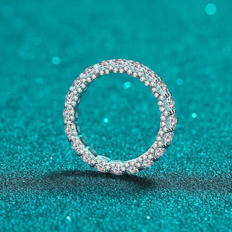 Bee-Bees 2.5ctw round moissanite full eternity band in 18k white gold plated sterling silver.