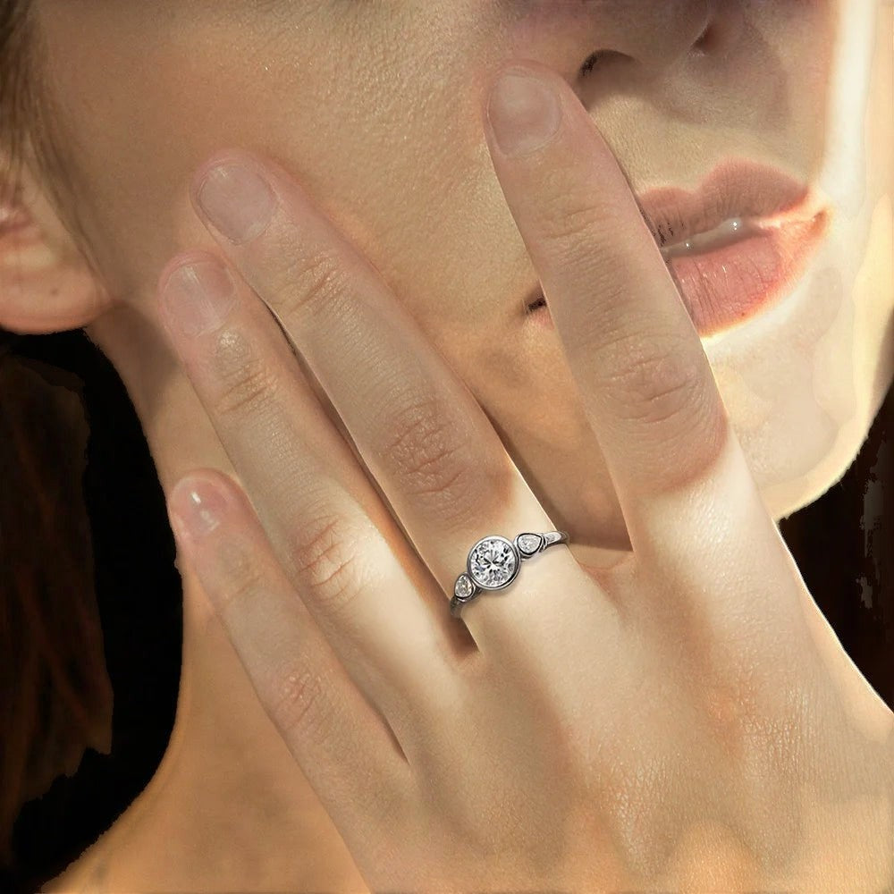 Bee-Bees 1.6ct 3-stone moissanite engagement ring in 925 sterling silver with 18k white gold plating. GRA certified.