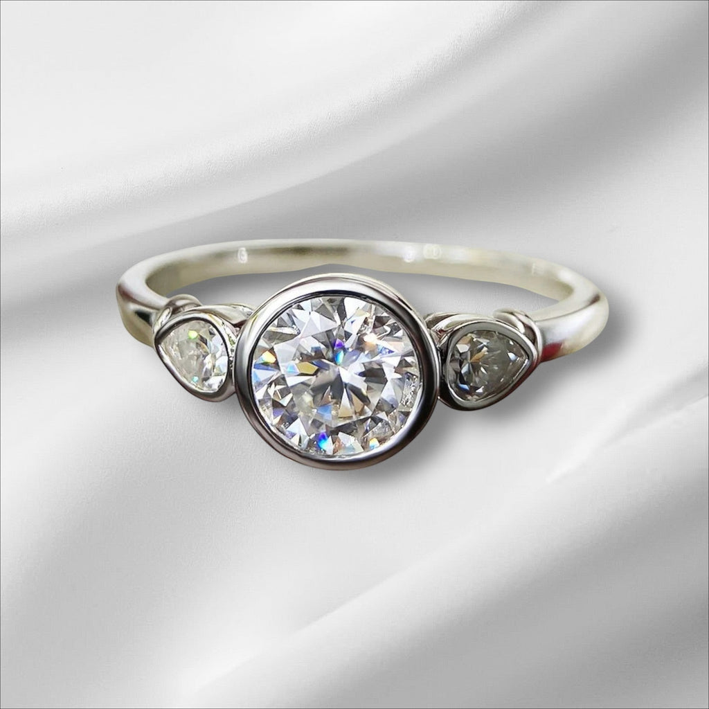 Bee-Bees 1.6ct 3-stone moissanite engagement ring in 925 sterling silver with 18k white gold plating. GRA certified.