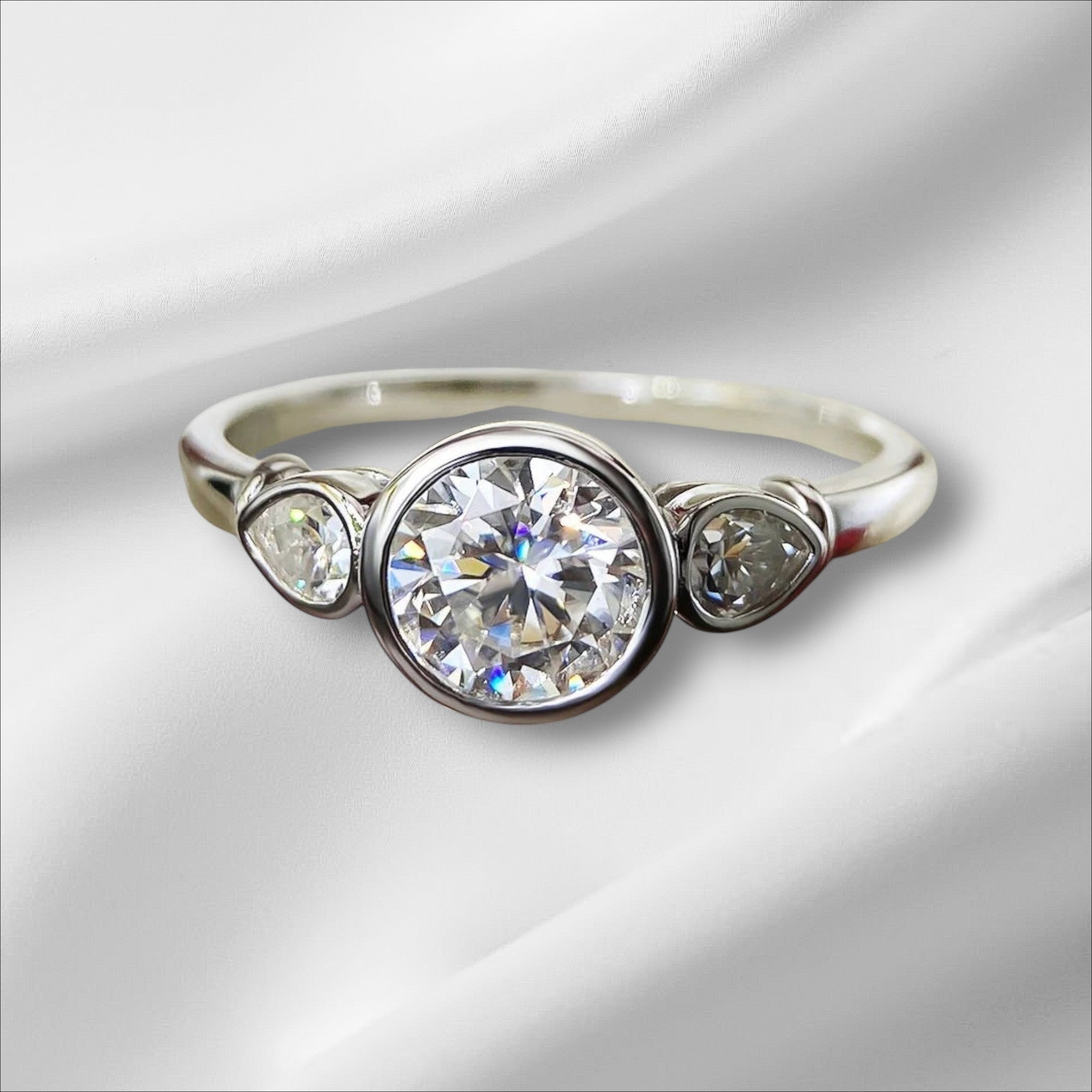 Bee-Bees 1.6ct 3-stone moissanite engagement ring in 925 sterling silver with 18k white gold plating. GRA certified.