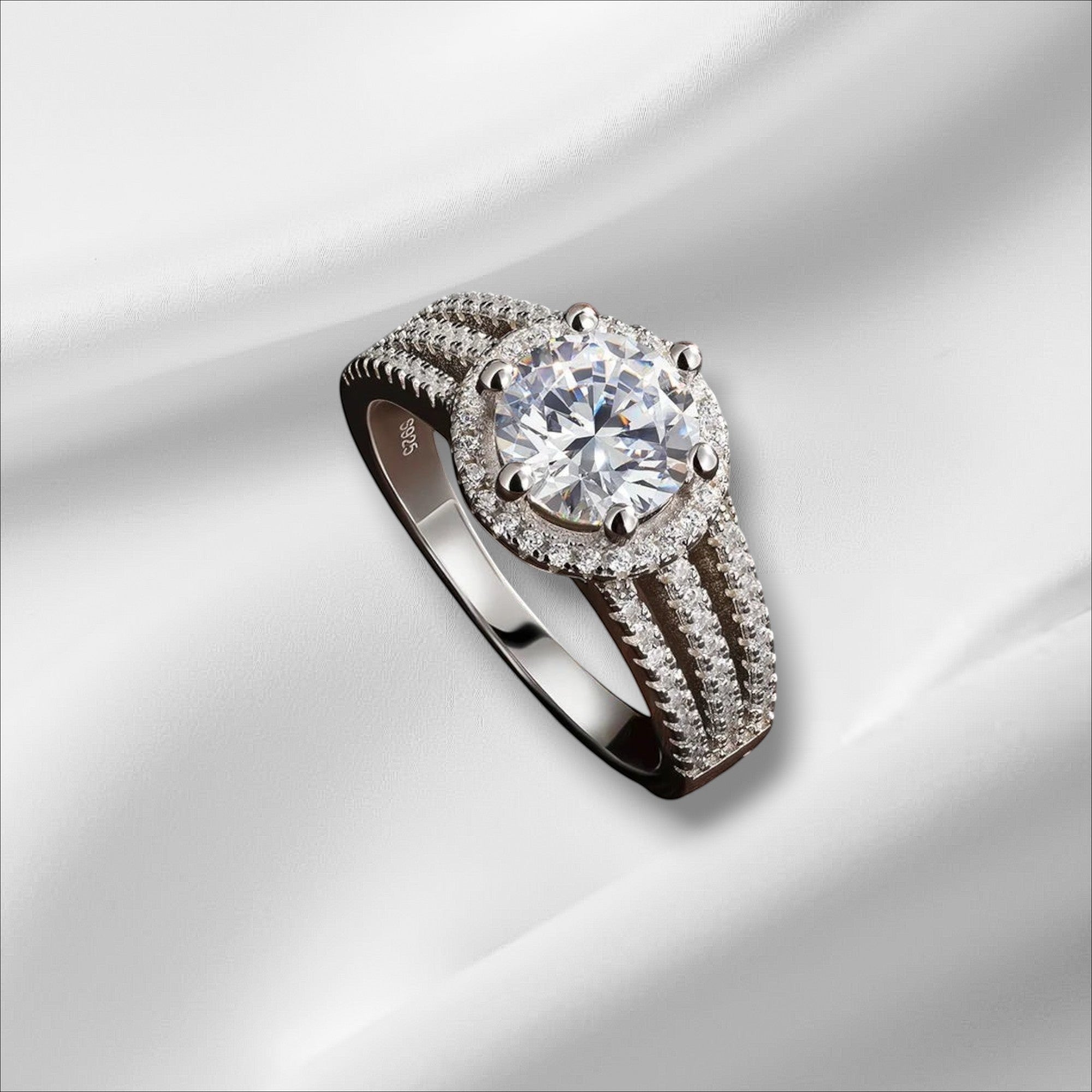 Bee-Bee's 3ct round brilliant cut moissanite engagement ring in s925 sterling silver with 18k white gold plating and halo of small stones.