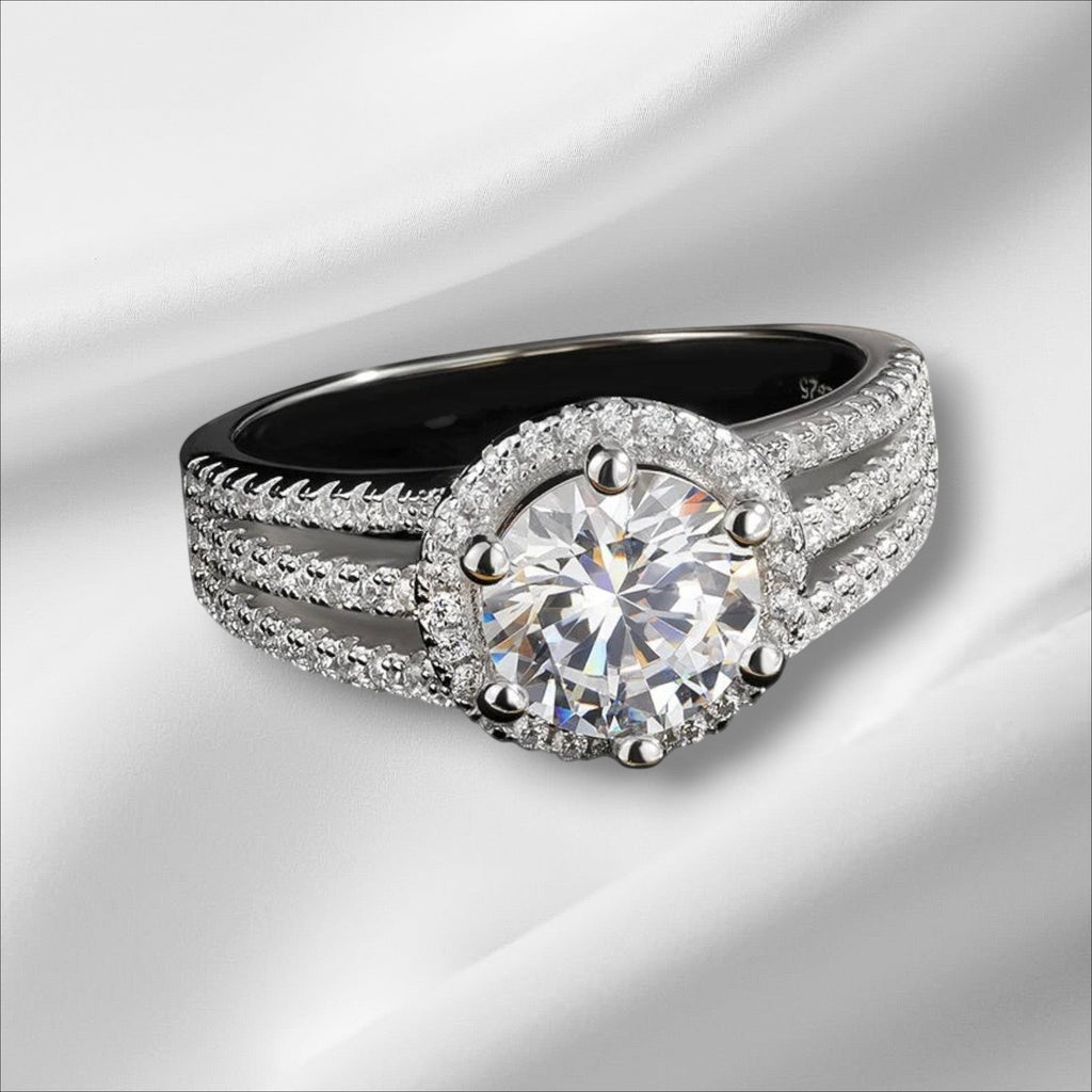 Bee-Bee's 3ct round brilliant cut moissanite engagement ring in sterling silver with 18k white gold plating and halo setting.