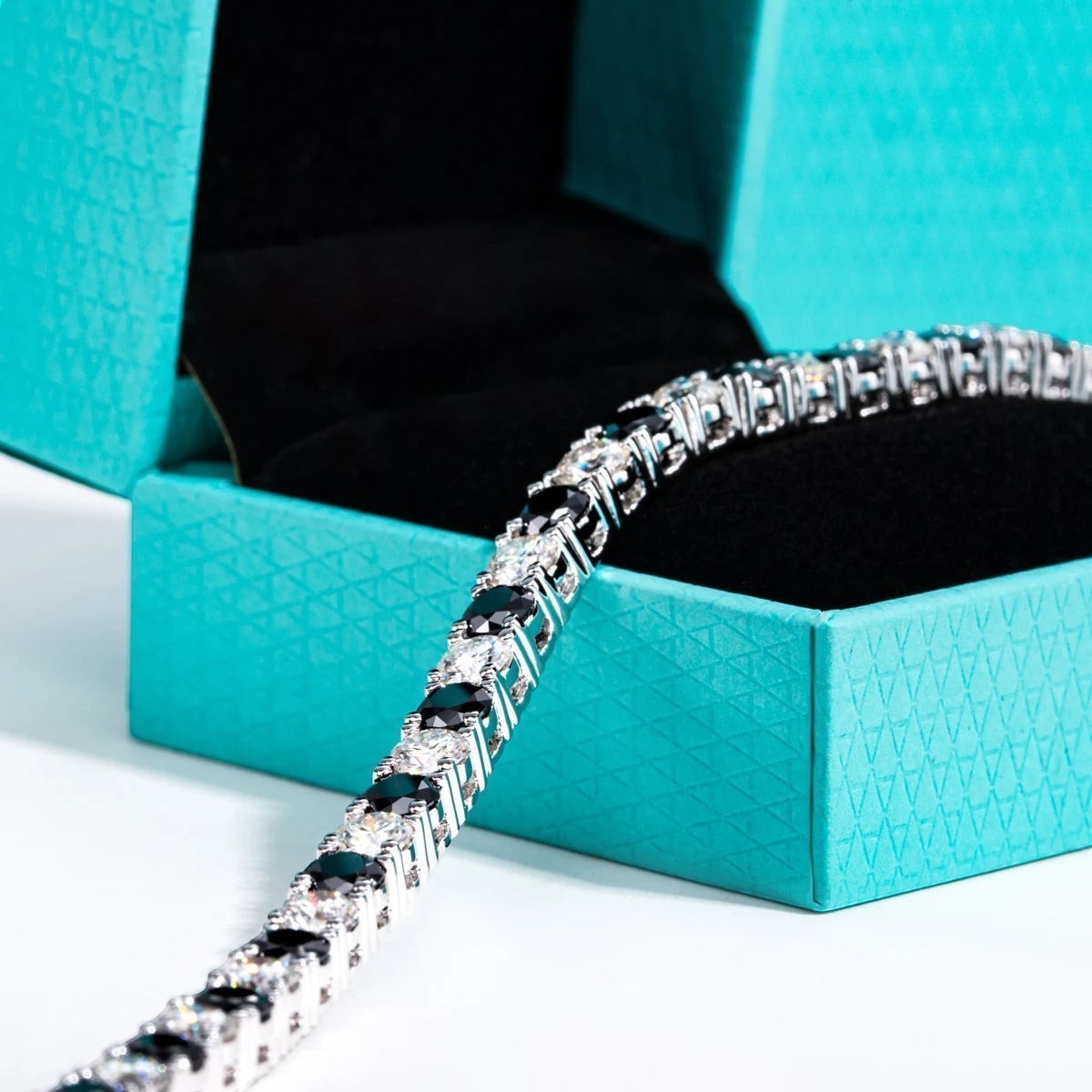 Bee-Bee's 4mm black moissanite tennis bracelet in s925 sterling silver with 18k white gold plating.