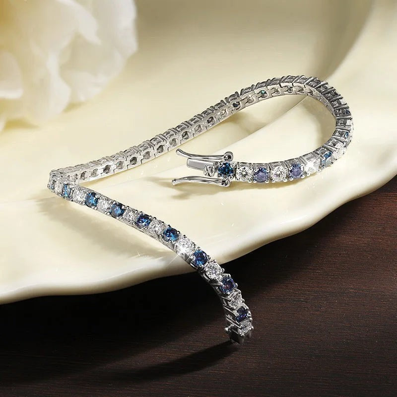 Bee-Bees blue and white moissanite tennis bracelet crafted from S925 sterling silver with 18k white gold plating.