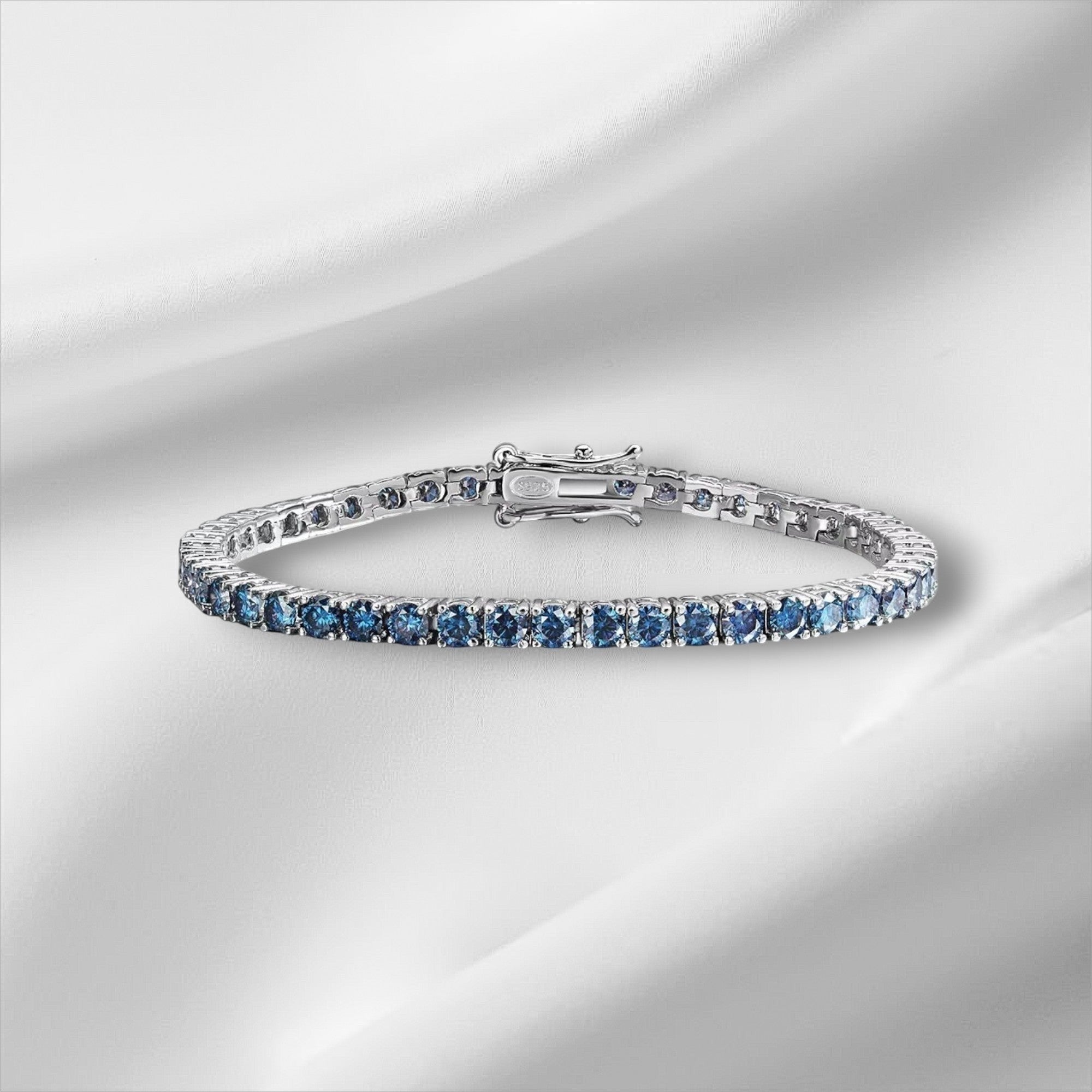Bee-Bees blue moissanite tennis bracelet crafted from S925 sterling silver with 18k white gold plating.