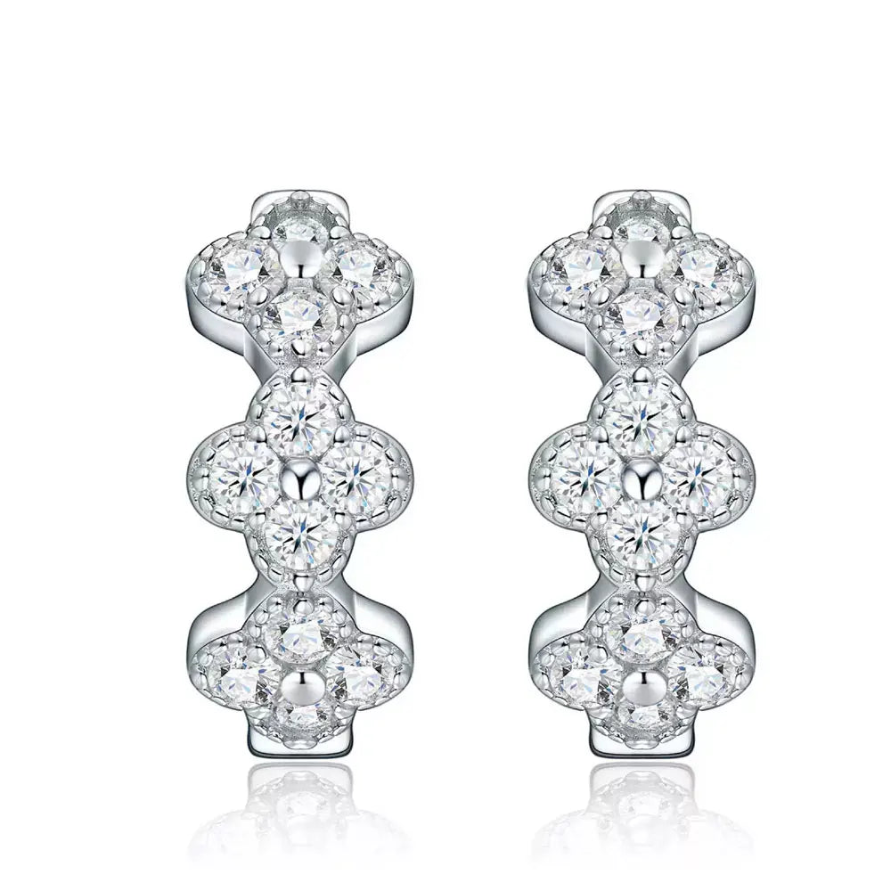 Bee-Bees four leaf clover huggie earrings in 925 sterling silver with sparkling D color moissanite stones.