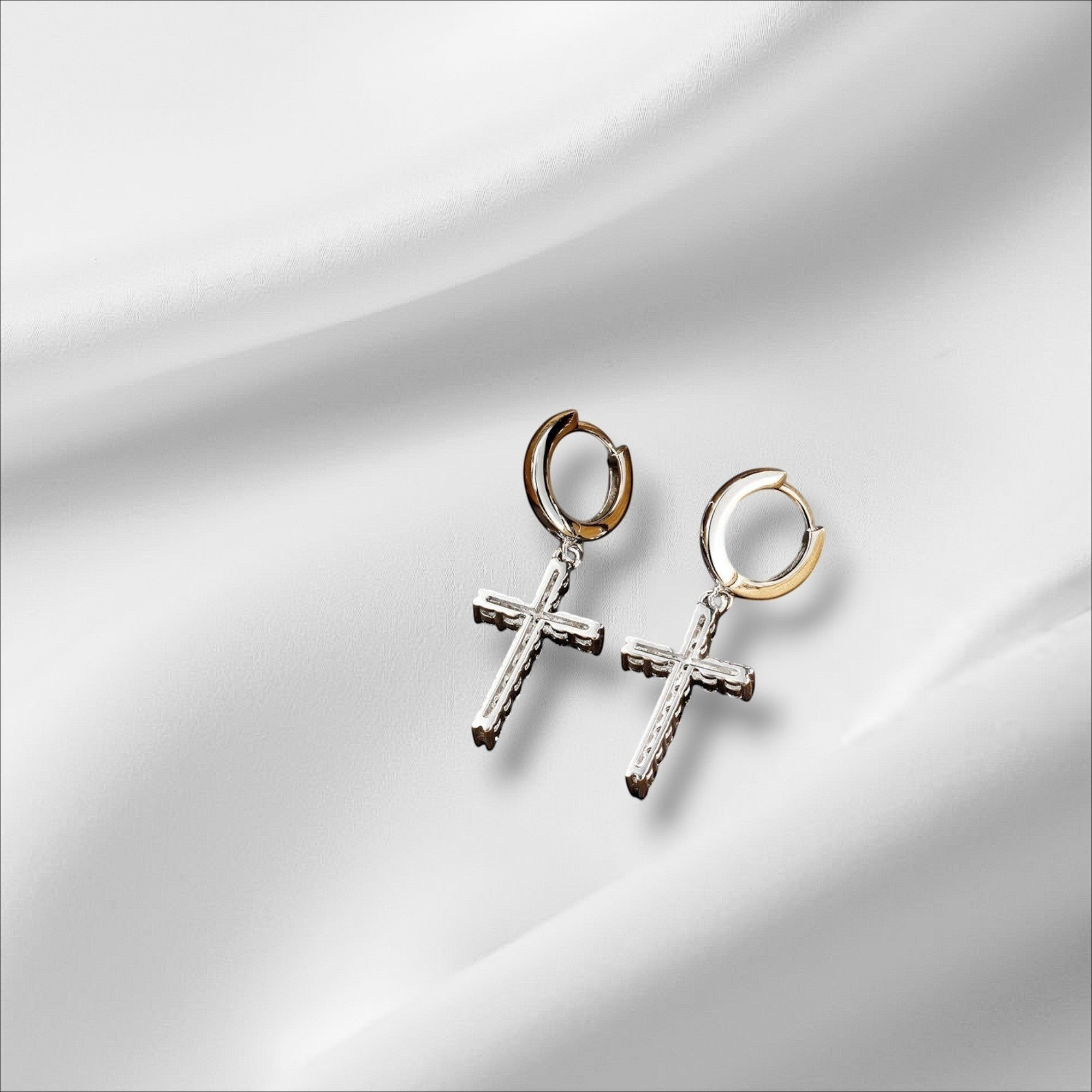 Bee-Bee's Sterling silver cross hoop earrings with moissanite stones and 18k white gold plating.