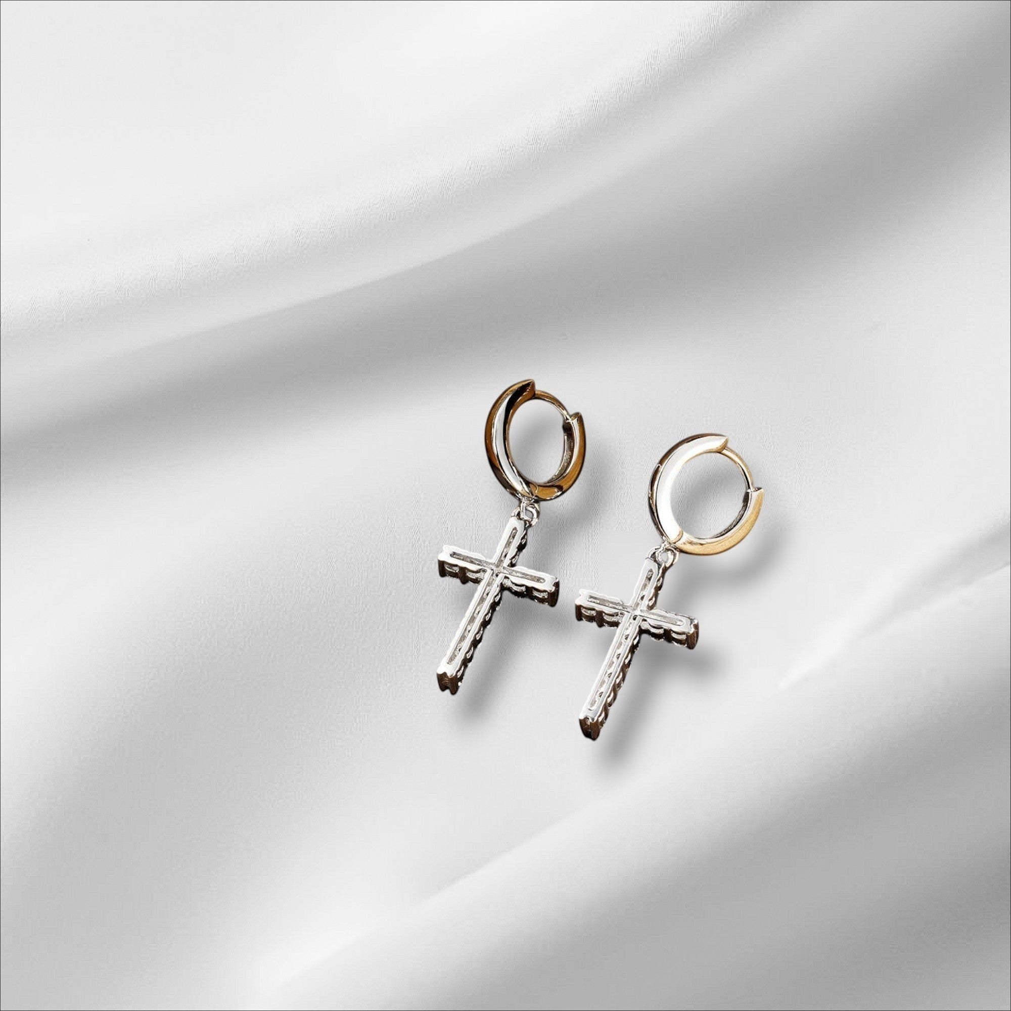Bee-Bee's Sterling silver cross hoop earrings with moissanite stones and 18k white gold plating.