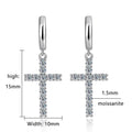 Bee-Bee's Sterling silver hoop earrings with dangling cross charms, encrusted with 24 round moissanite stones.