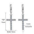 Bee-Bee's Sterling silver hoop earrings with dangling cross charms, encrusted with 24 round moissanite stones.