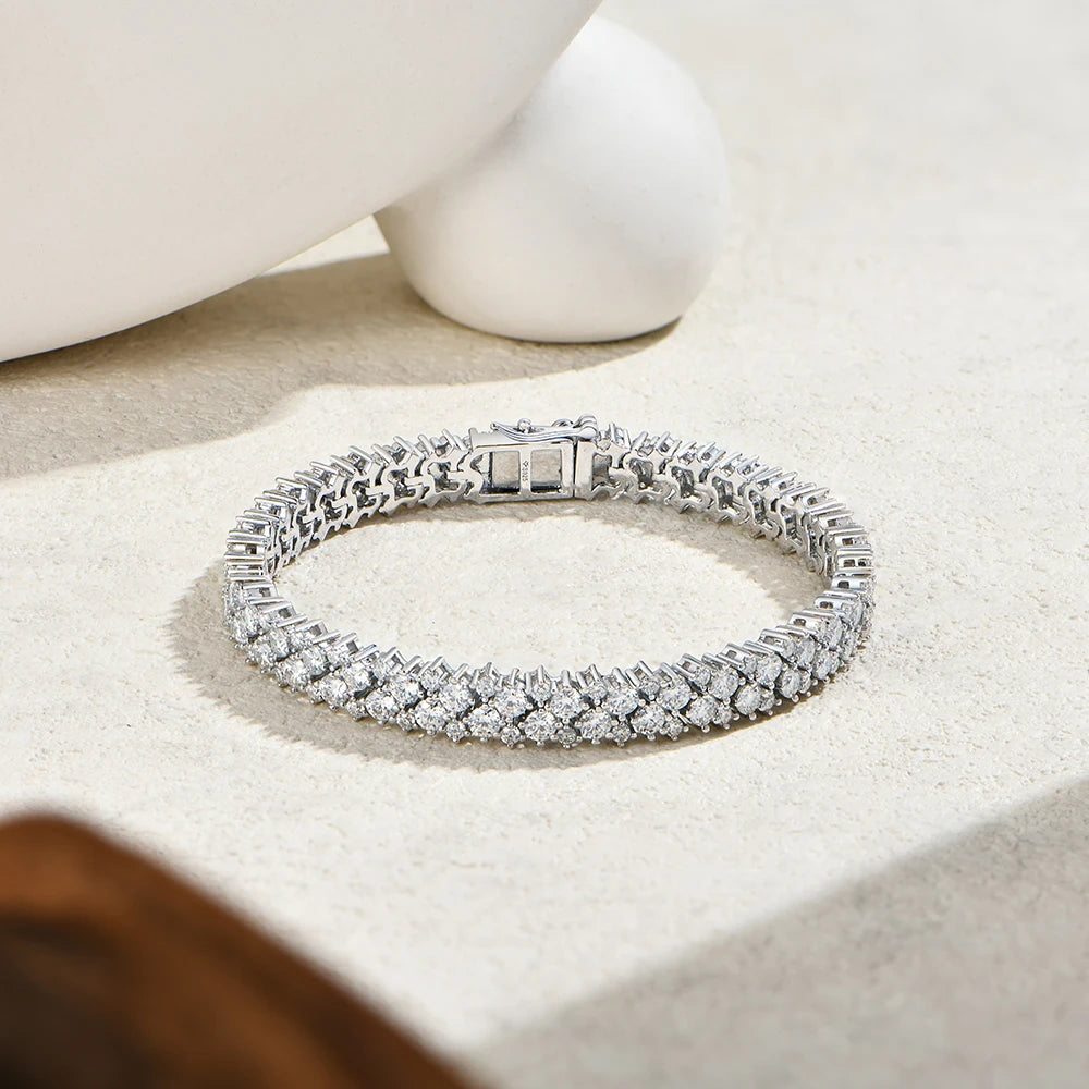 Bee-Bees double row moissanite tennis bracelet in 925 sterling silver with brilliant VVS1 stones on a neutral surface
