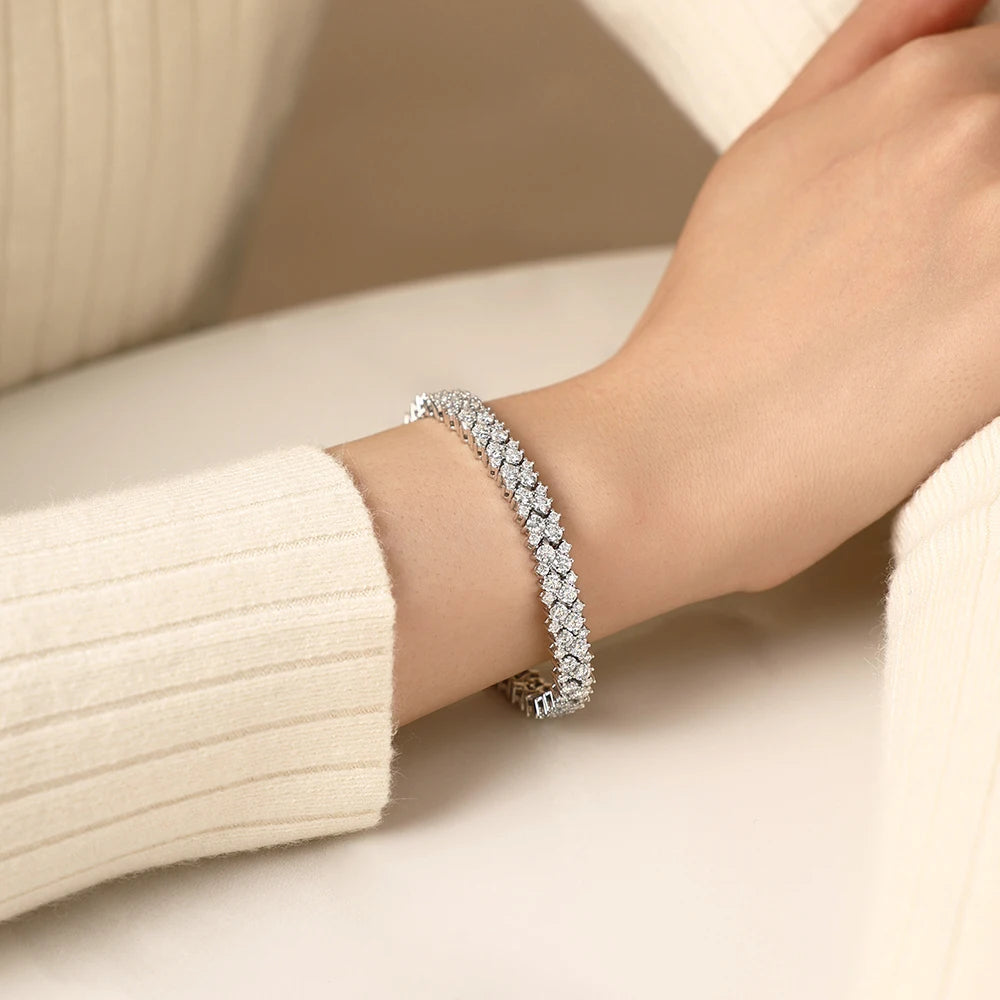 Bee-Bees double row moissanite tennis bracelet in 925 sterling silver worn on a wrist, featuring brilliant stones.