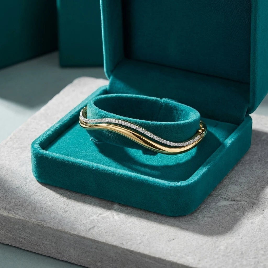 Bee-Bee's double wavy bangle in 18K gold plated sterling silver with 1.5mm D Color Moissanite stones.
