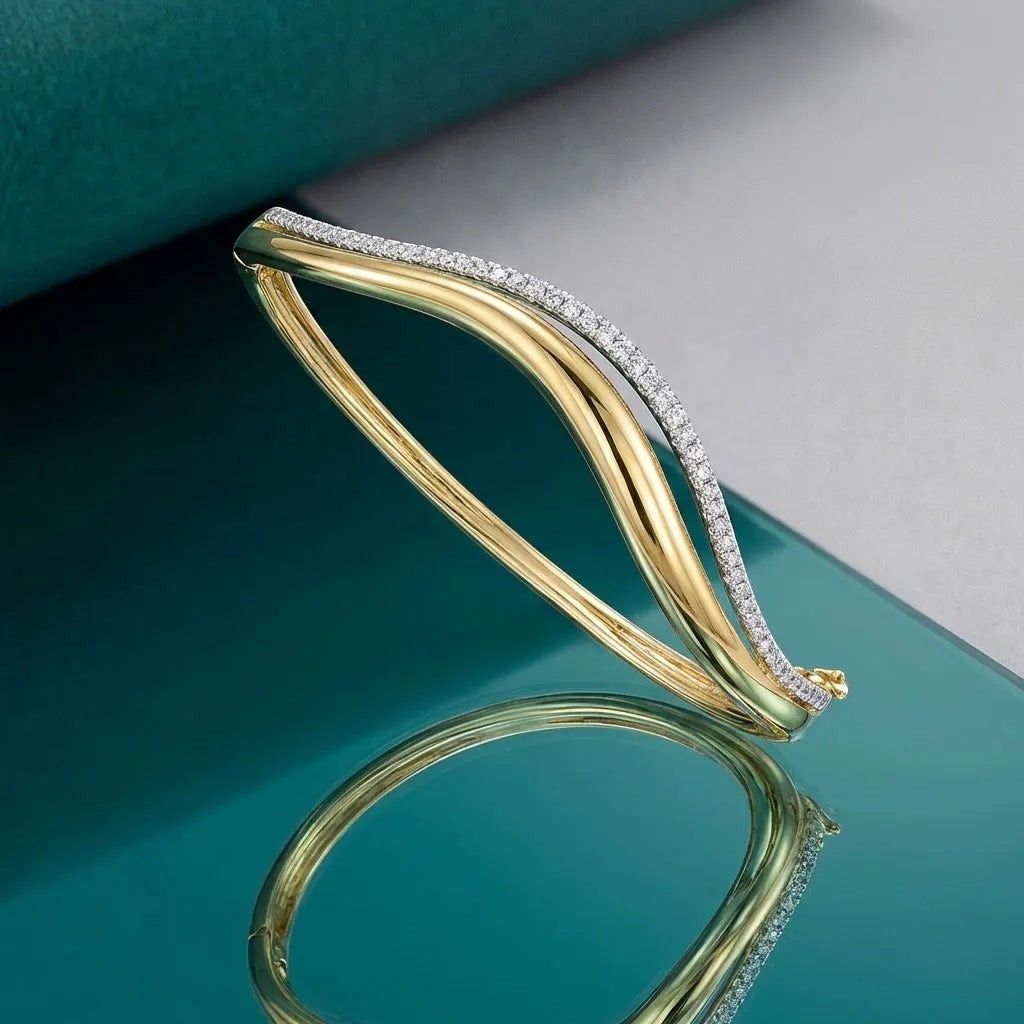Bee-Bees double wavy 18K gold plated sterling silver bangle with 1.5mm D Color Moissanite stones.