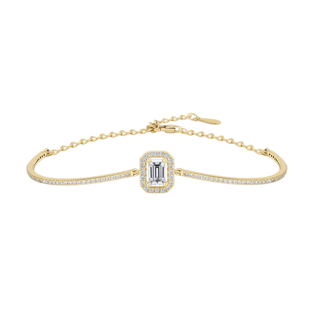 Bee-Bees emerald cut moissanite tennis bracelet in 18K gold plated 925 sterling silver with a delicate chain design.