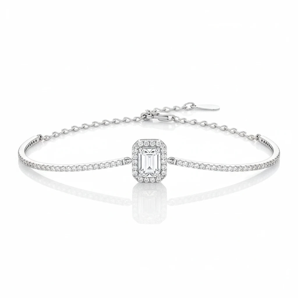 Bee-Bees emerald cut moissanite tennis bracelet in 925 sterling silver with a delicate chain and adjustable clasp.