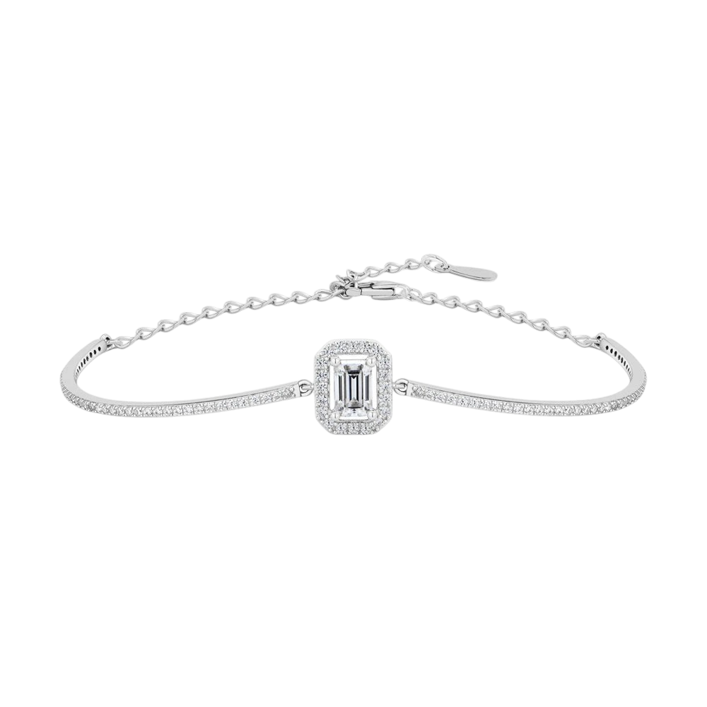 Bee-Bees emerald cut moissanite tennis bracelet in 925 sterling silver with a delicate chain and halo setting.