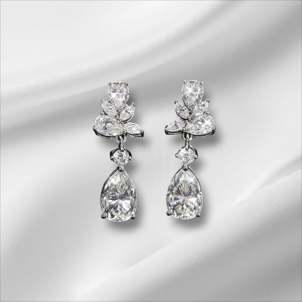 Bee-Bees Emerald Cut Moissanite Drop Earrings with 8.8ct D Color stones and 18k gold plating.