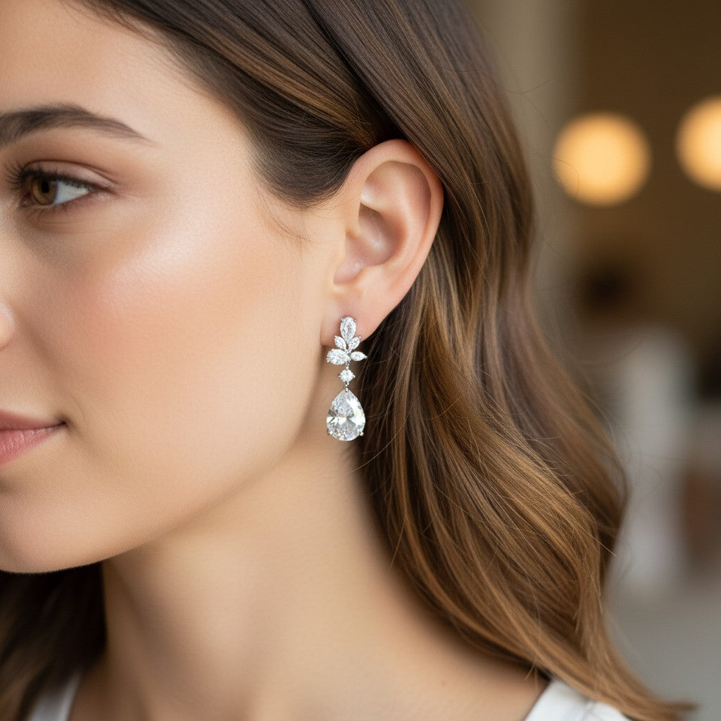 Bee-Bees emerald cut moissanite drop earrings worn by a woman, featuring 8.8ct D color stones in S925 sterling silver.