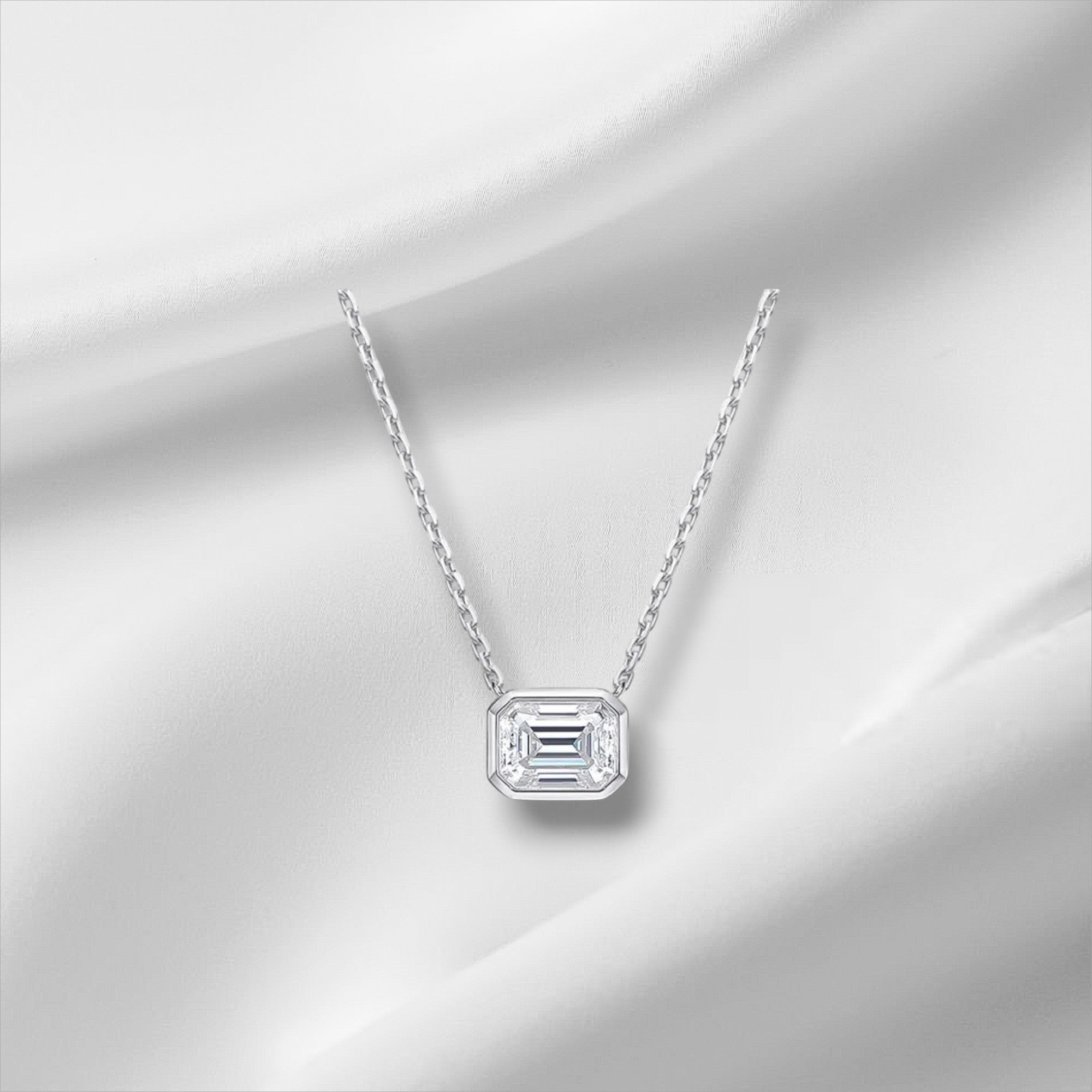 Bee-Bee's 2ct emerald cut moissanite necklace with D color, VVS1 clarity, set in 18k gold plated sterling silver.
