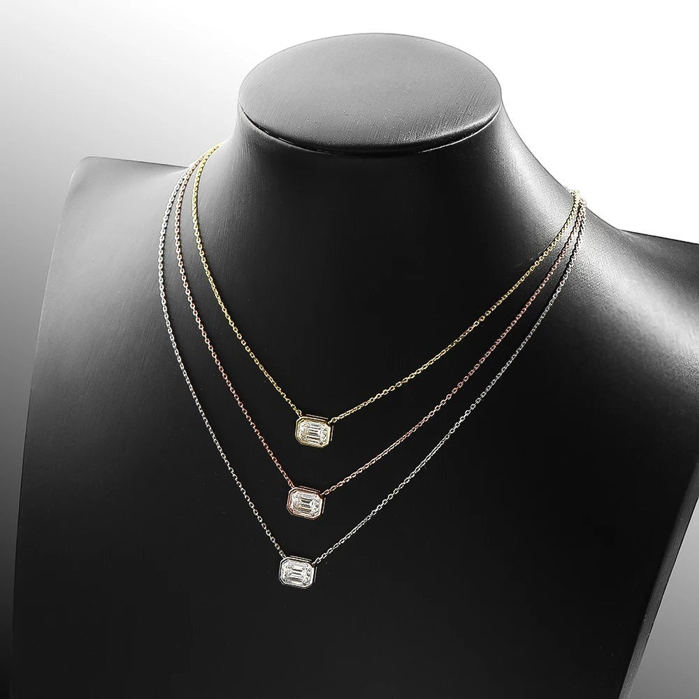 Bee-Bees 2ct emerald cut moissanite necklace in yellow, rose, and white gold plating on sterling silver.