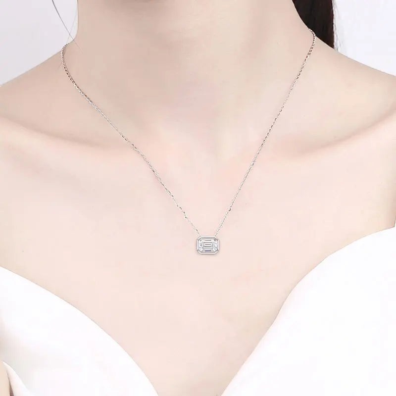 Bee-Bee's 2ct emerald cut moissanite necklace with D color, VVS1 clarity, on a sterling silver chain with 18k gold plating.