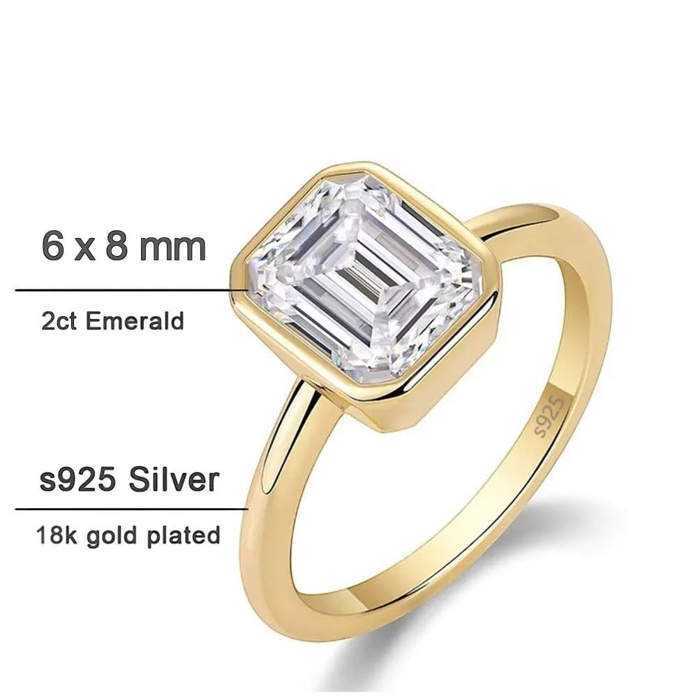 Bee-Bees 2ct emerald cut moissanite engagement ring in 18k white gold plated sterling silver with GRA certification.