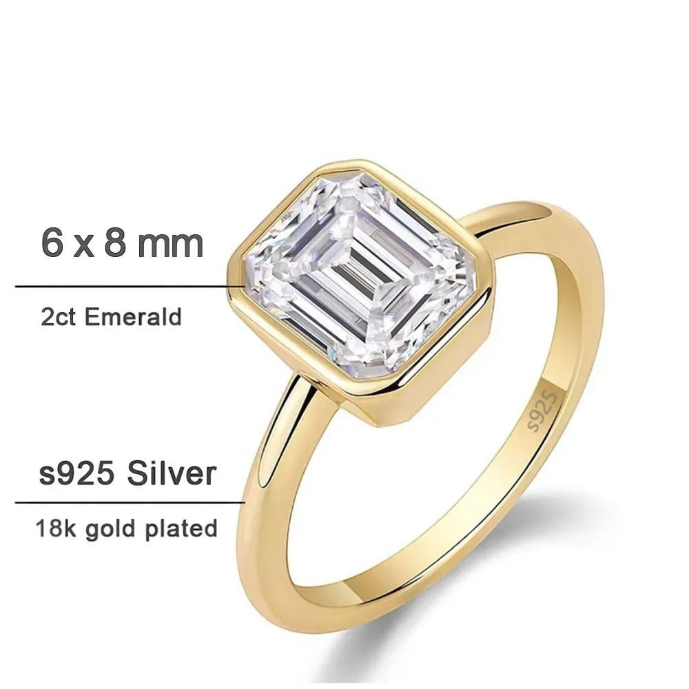 Bee-Bees 2ct emerald cut moissanite engagement ring in 18k white gold plated sterling silver with GRA certification.