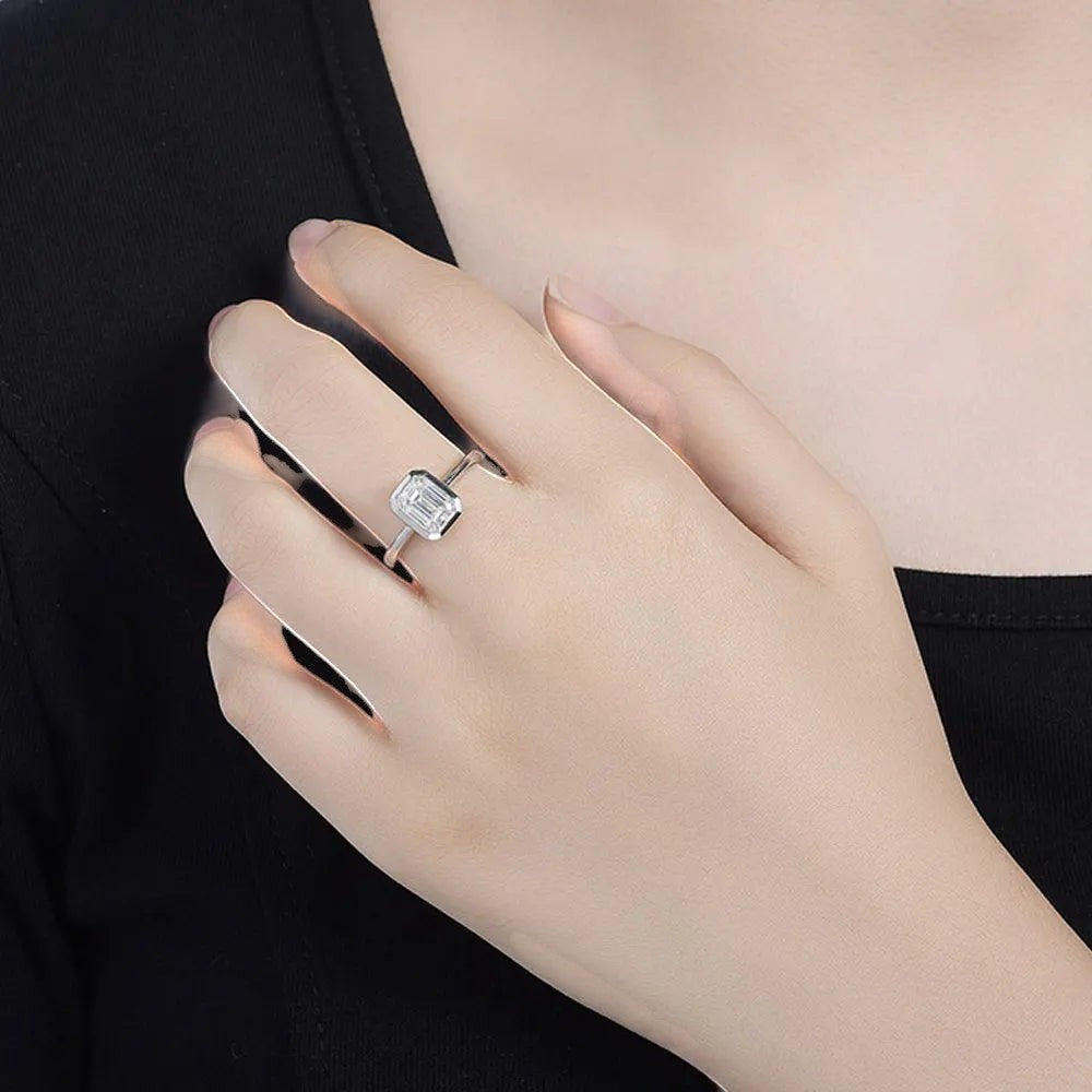 Bee-Bees 2CT emerald cut moissanite engagement ring in 18k white gold plated sterling silver with GRA certification.