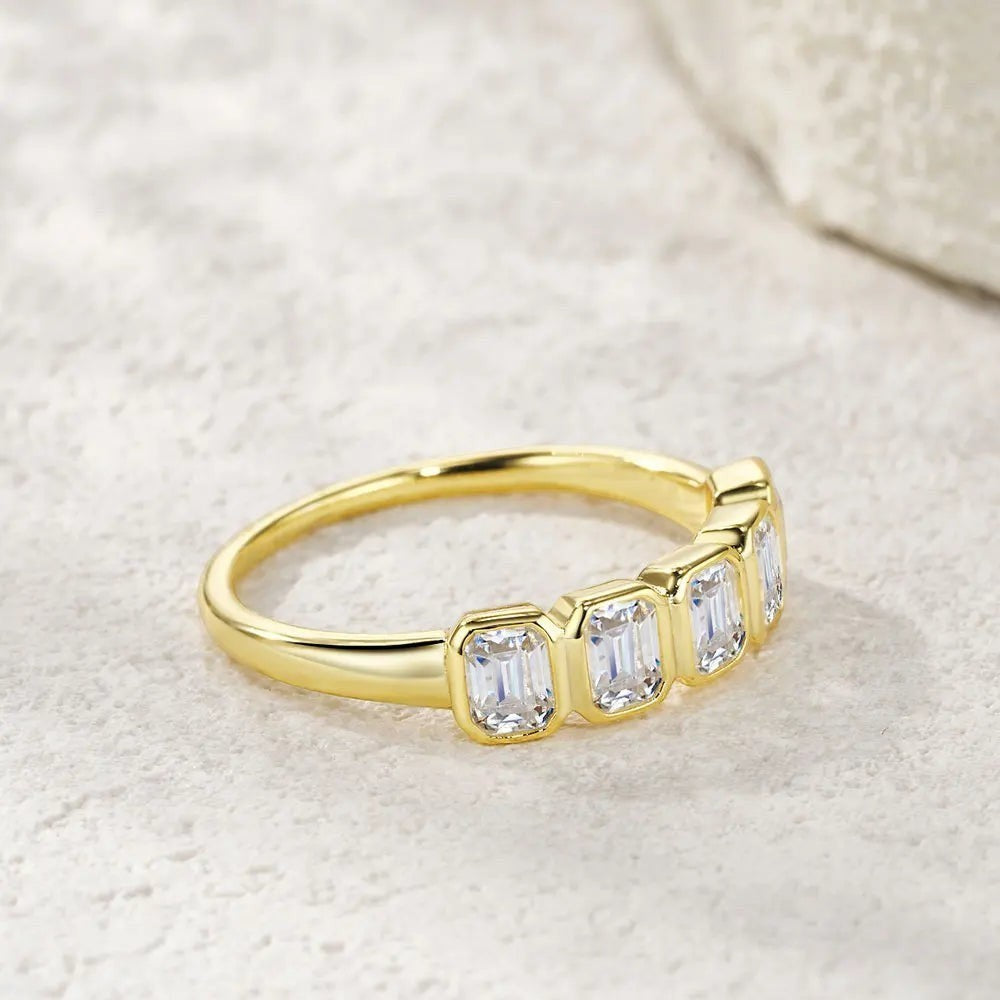Bee-Bees 2.5ctw emerald cut moissanite 5-stone band in 18k gold plated sterling silver.