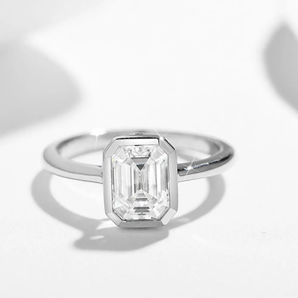 Bee-Bees 2CT emerald cut moissanite engagement ring in 18k white gold plated sterling silver with GRA certification.