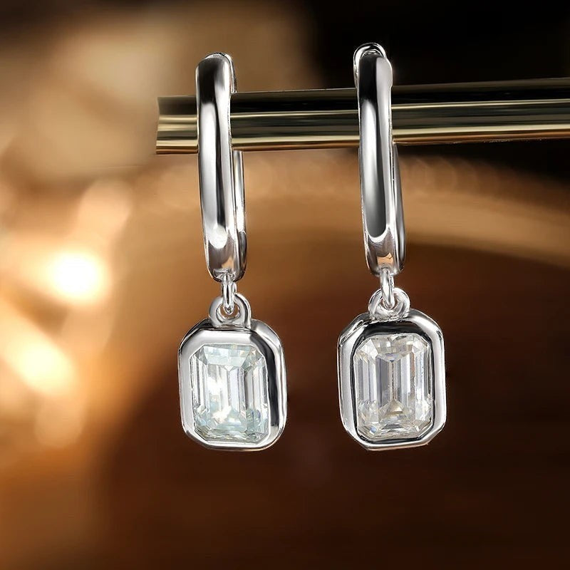 Bee-Bees D Color Emerald Cut Moissanite Hoop Drop Earrings in 18k white gold plated sterling silver.