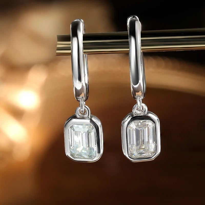 Bee-Bees D Color Emerald Cut Moissanite Hoop Drop Earrings in 18k white gold plated sterling silver.