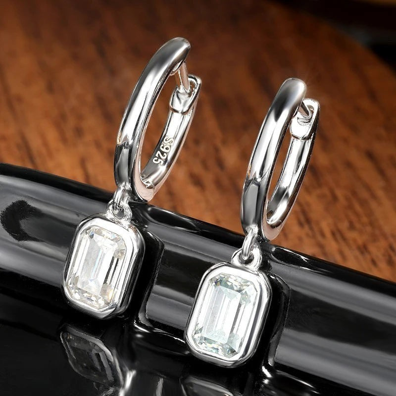Bee-Bees D Color Emerald Cut Moissanite Hoop Drop Earrings in 18k white gold plated sterling silver.