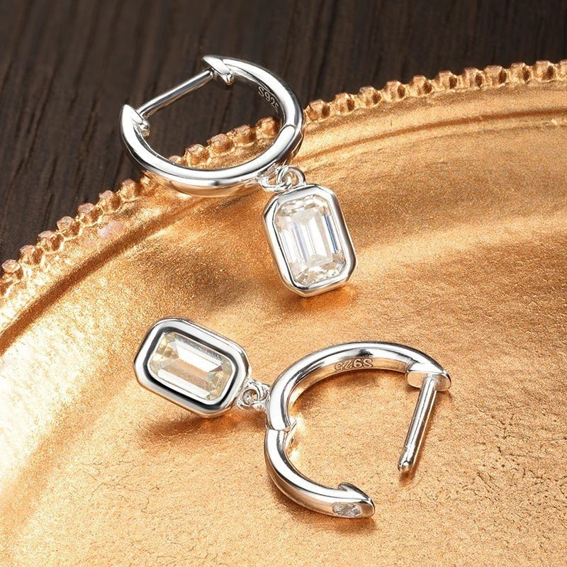 Bee-Bees D Color Emerald Cut Moissanite Hoop Drop Earrings in 18k White Gold Plated Sterling Silver.