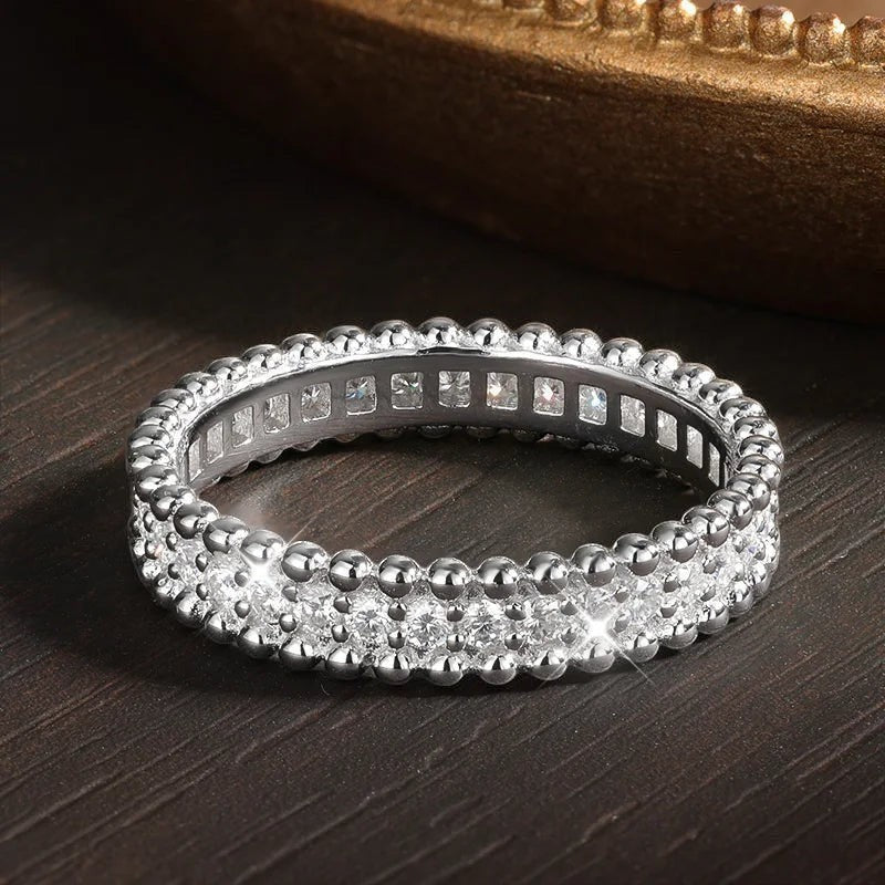 Bee-Bees full eternity stackable wedding band with VVS1 D-color moissanite stones and 18k white gold plated sterling silver.