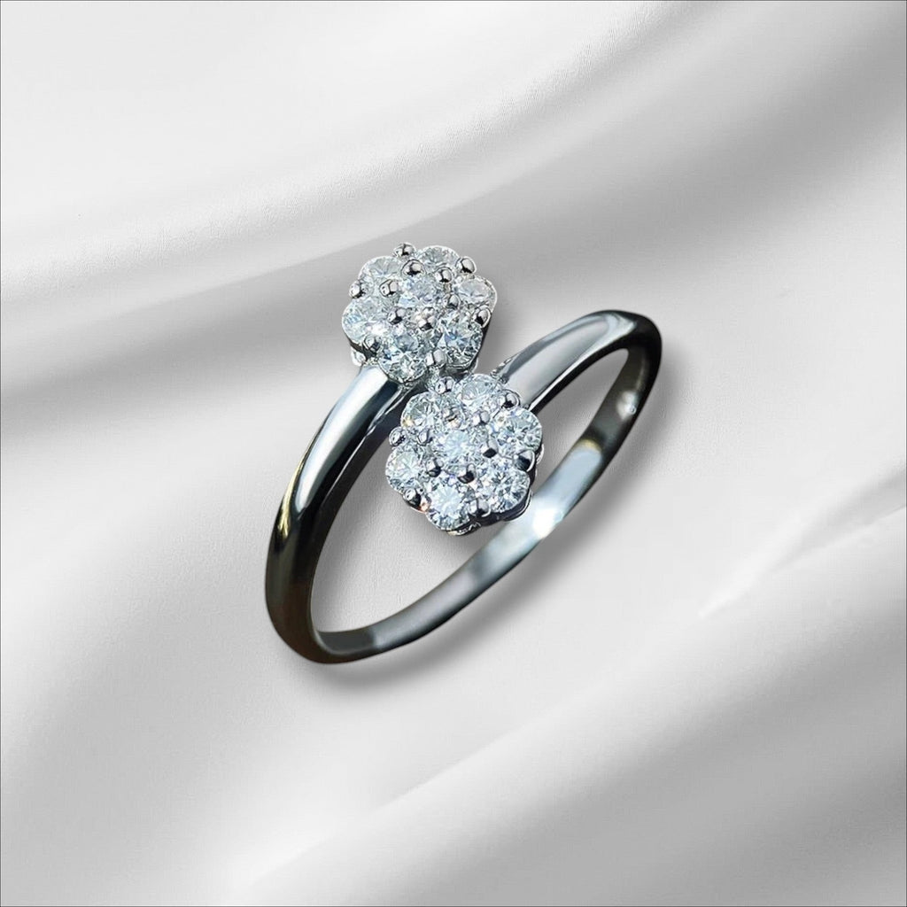 Bee-Bee's sterling silver ring with two floral clusters of round moissanite stones, D VVS1 certified.
